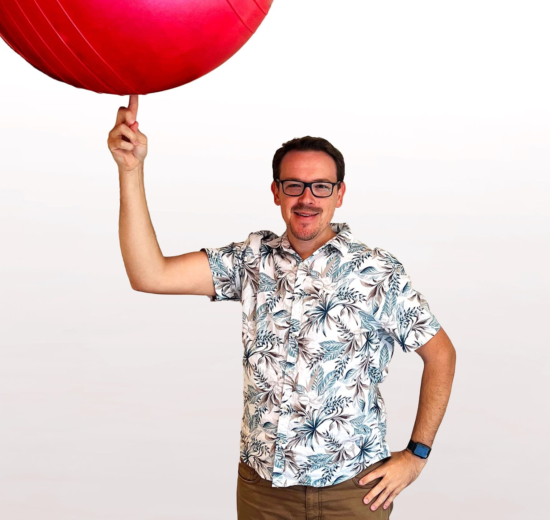 Cameron balancing fitball on finger